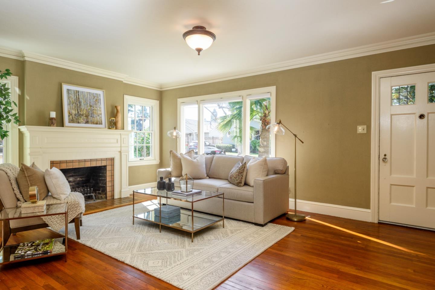 132 Bancroft Road Burlingame, CA 94010 - Photo 4 of 27 a living room with furniture and a fireplace