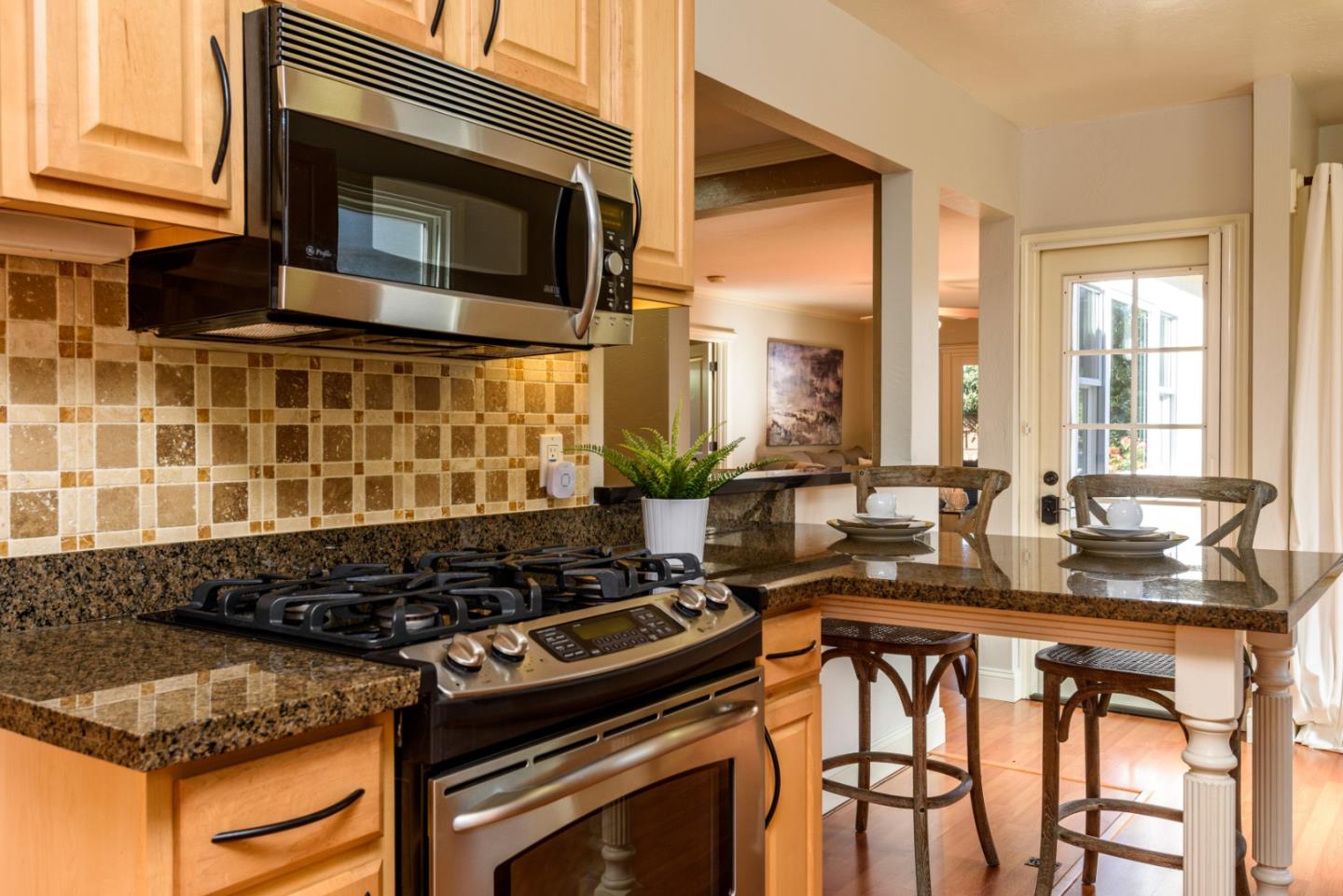 132 Bancroft Road Burlingame, CA 94010 - Photo 8 of 27 a kitchen with a stove and a microwave