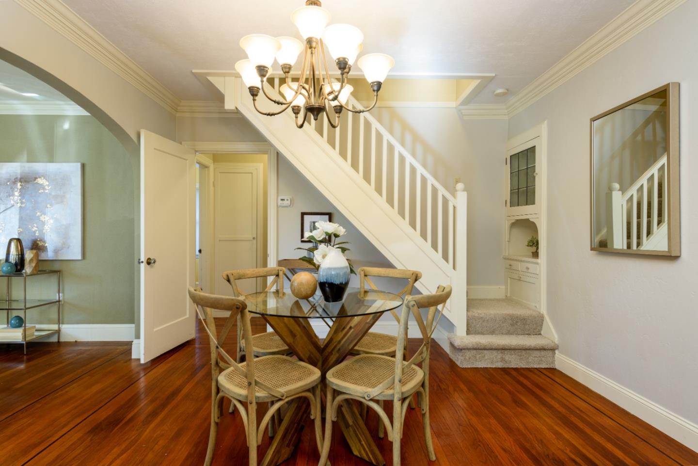132 Bancroft Road Burlingame, CA 94010 - Photo 10 of 27 a view of a dining room with furniture and wooden floor