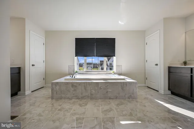 a living room with a fireplace furniture and a window
