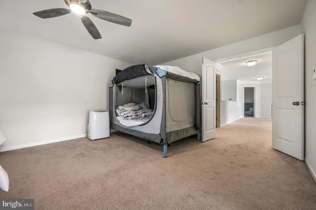 a view of an empty room and a window