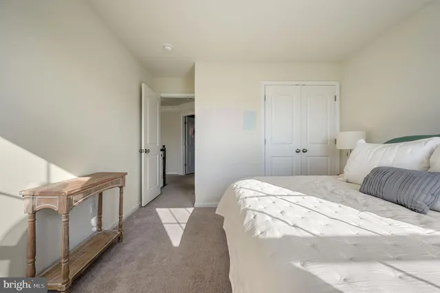 a bedroom with a bed and cabinets