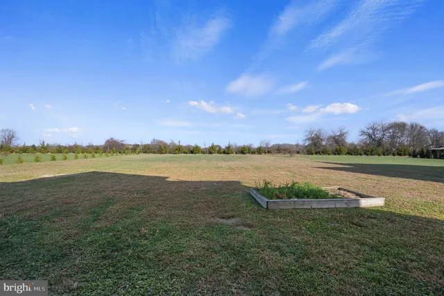 a view of a lake with houses in the back