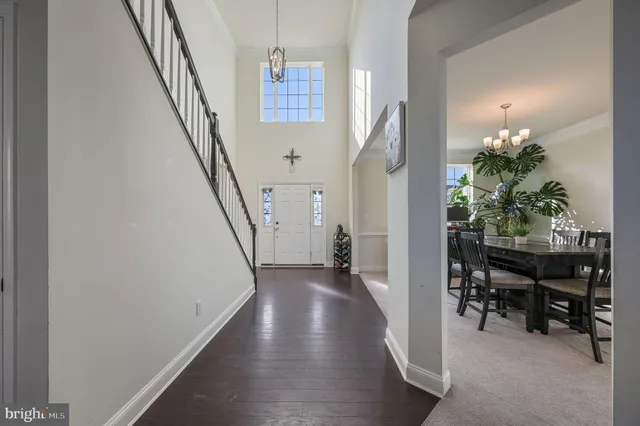 a view of a hallway with furniture and entryway