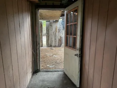 a view of a front door and wooden door