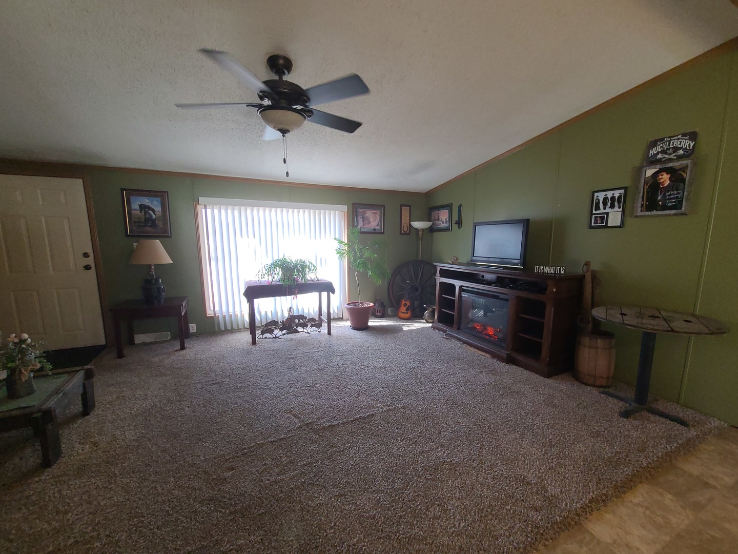 291 Highway 2, Unit 49 Dixon, IL 61021 - Photo 17 of 28 a living room with furniture and a chandelier