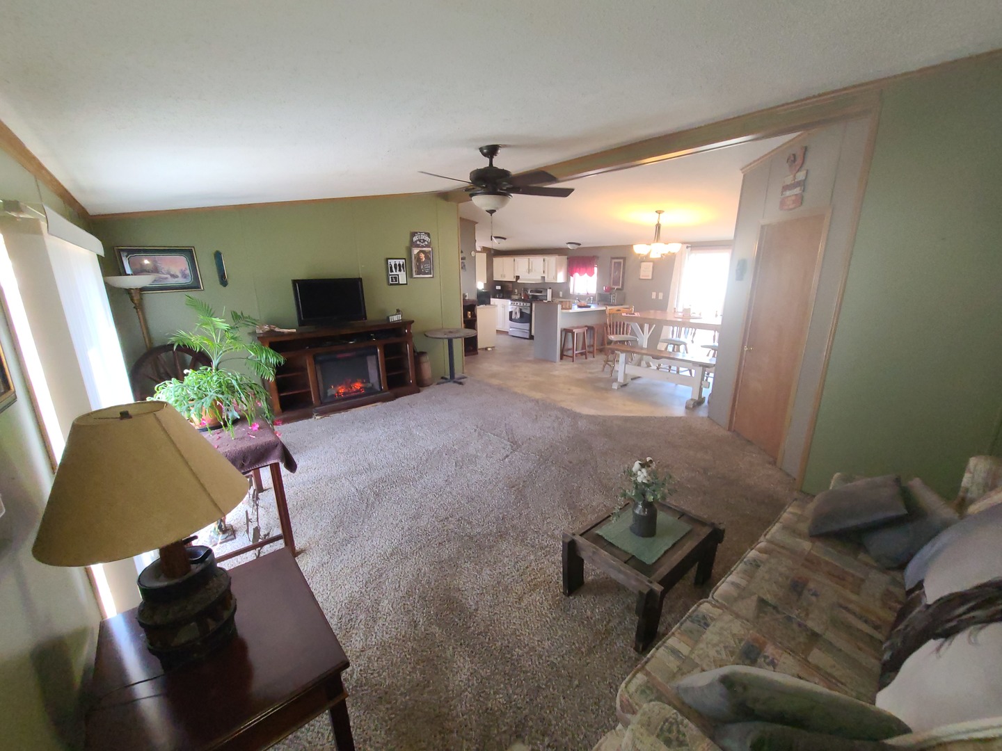 291 Highway 2, Unit 49 Dixon, IL 61021 - Photo 18 of 28 a living room with furniture and a flat screen tv