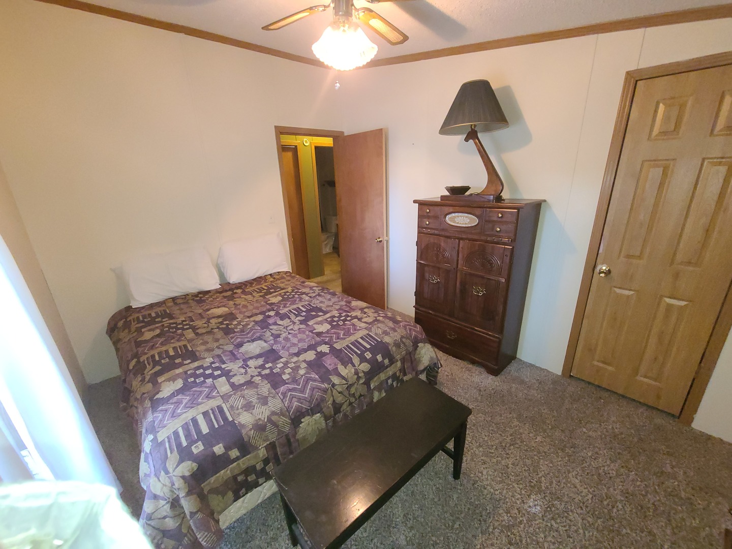 291 Highway 2, Unit 49 Dixon, IL 61021 - Photo 23 of 28 a bedroom with a bed and wooden floor