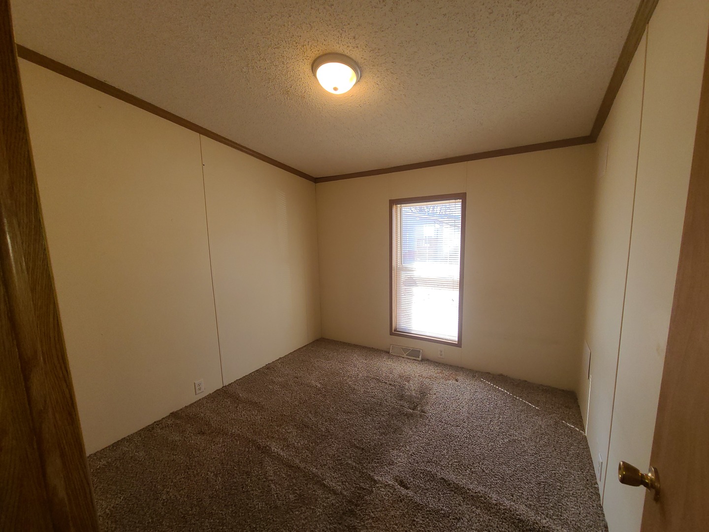 291 Highway 2, Unit 49 Dixon, IL 61021 - Photo 25 of 28 a view of empty room with window