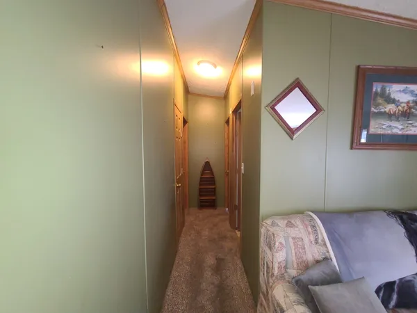 a bedroom with bed and a chandelier