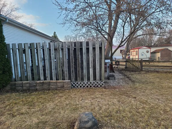 a view of outdoor space with wooden fence