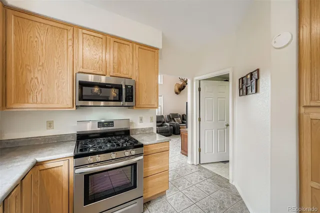 a kitchen with a stove and a microwave