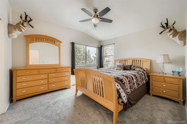 a spacious bedroom with a bed and window