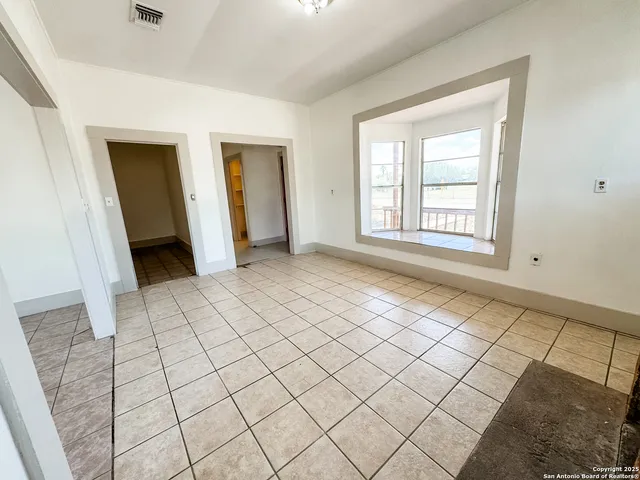 a view of an empty room and window