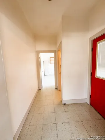 a view of a bathroom from a hallway