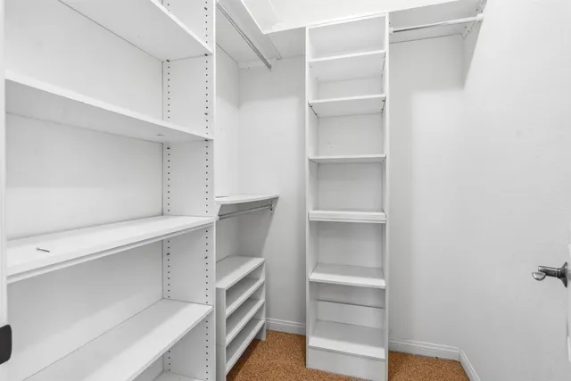 a view of an empty walk in closet