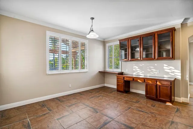 a large kitchen with granite countertop a stove and a sink