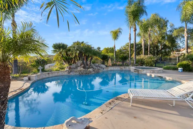 a view of swimming pool with a patio