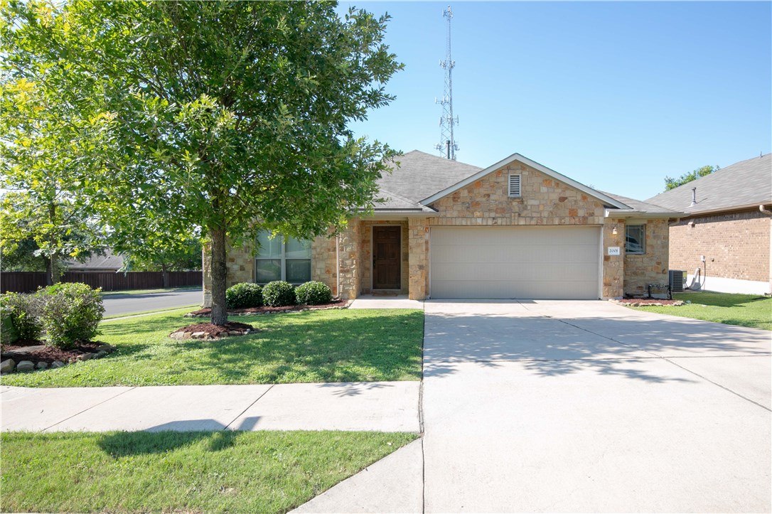 2001 Christoff Loop Austin, TX 78748 - Photo 1 of 1 a front view of a house with a yard and garage