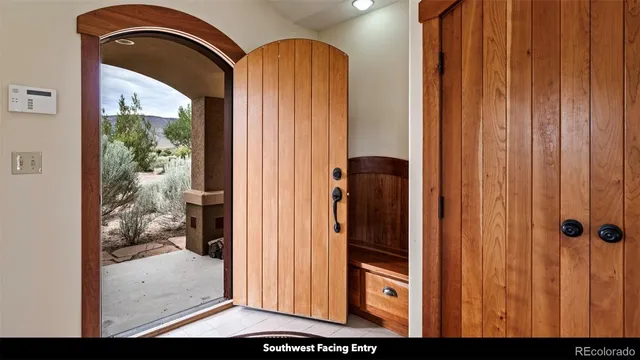 a view of a room with a large window and couch