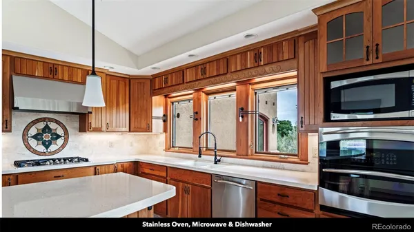 a bathroom with a sink a vanity and a mirror