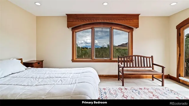 a view of a room with a window and chair