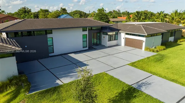 a aerial view of a house with a yard