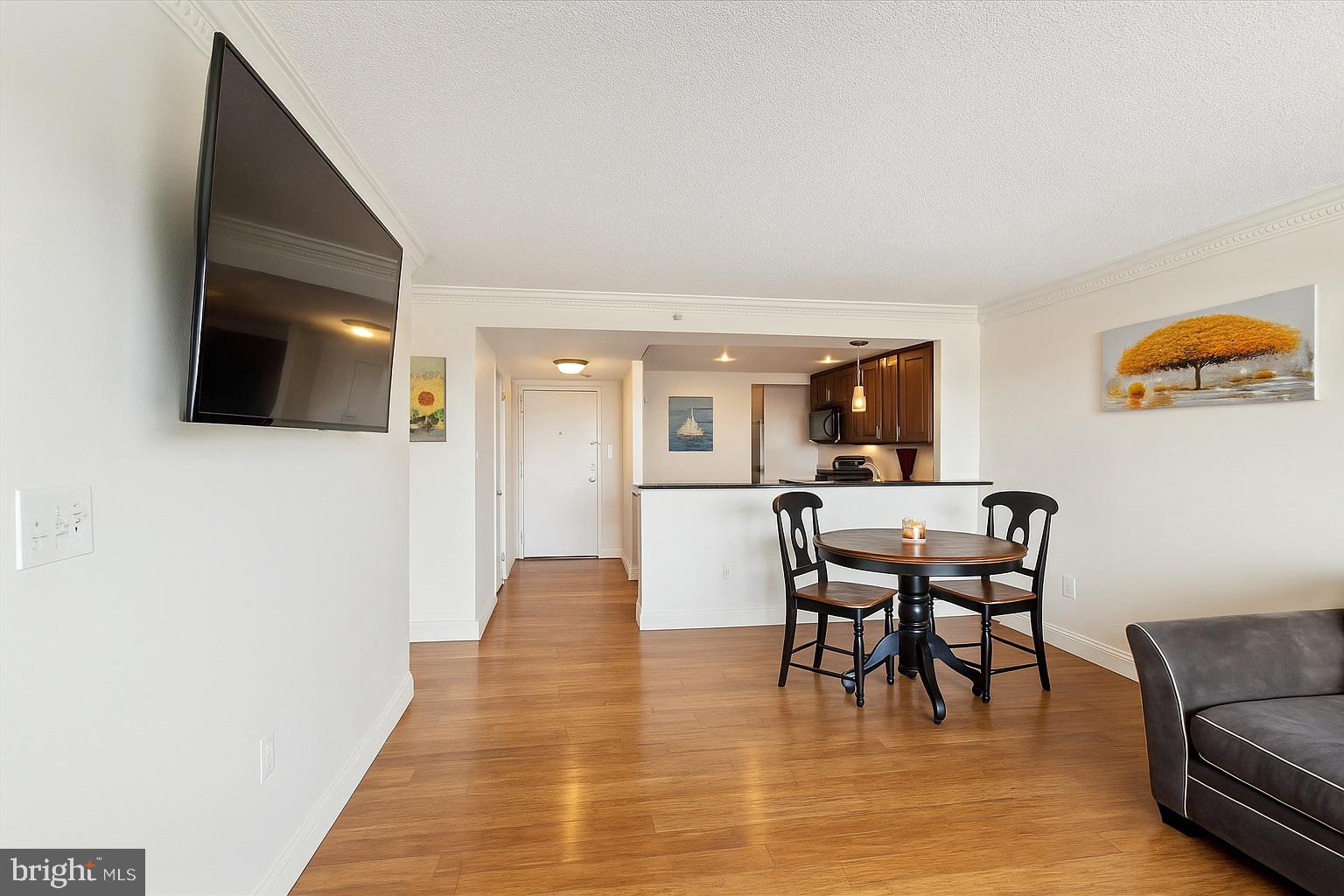 2001 Hamilton Street, Unit 1523 Philadelphia, PA 19130 - Photo 4 of 17 a view of a livingroom with furniture and a flat screen tv