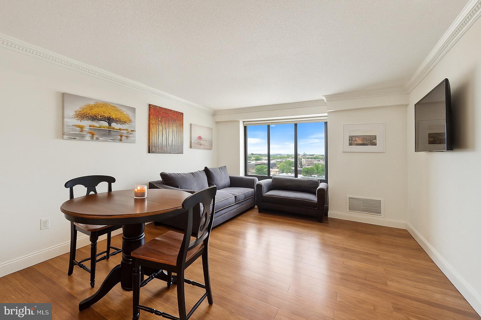 2001 Hamilton Street, Unit 1523 Philadelphia, PA 19130 - Photo 5 of 17 a living room with furniture and a wooden floor