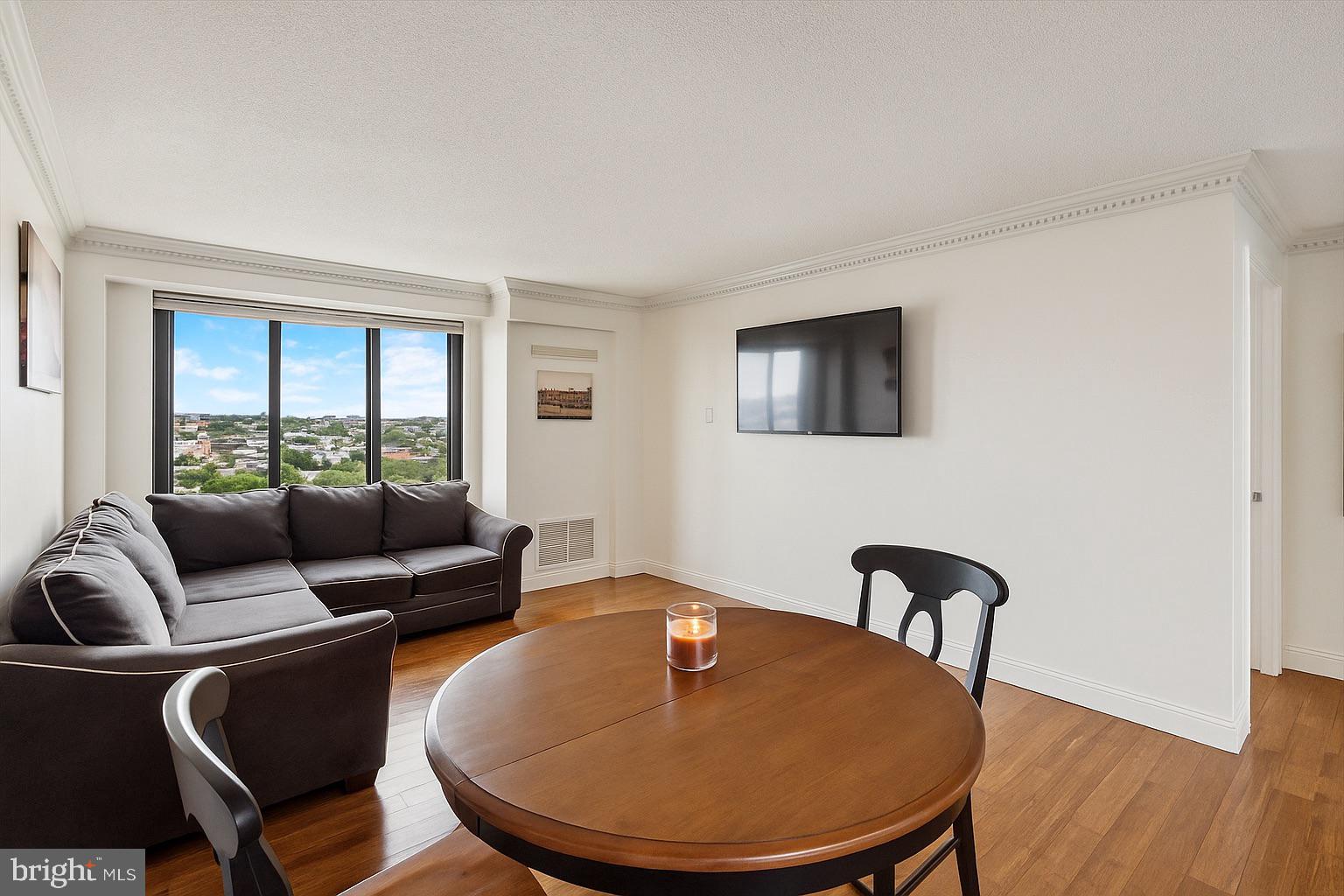 2001 Hamilton Street, Unit 1523 Philadelphia, PA 19130 - Photo 6 of 17 a living room with furniture and a window