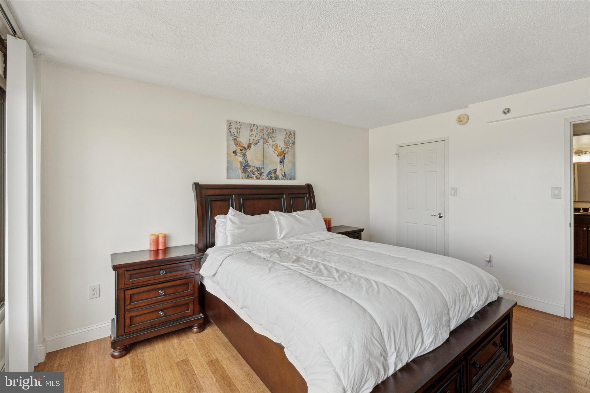 2001 Hamilton Street, Unit 1523 Philadelphia, PA 19130 - Photo 9 of 17 a bedroom with a bed and a dresser