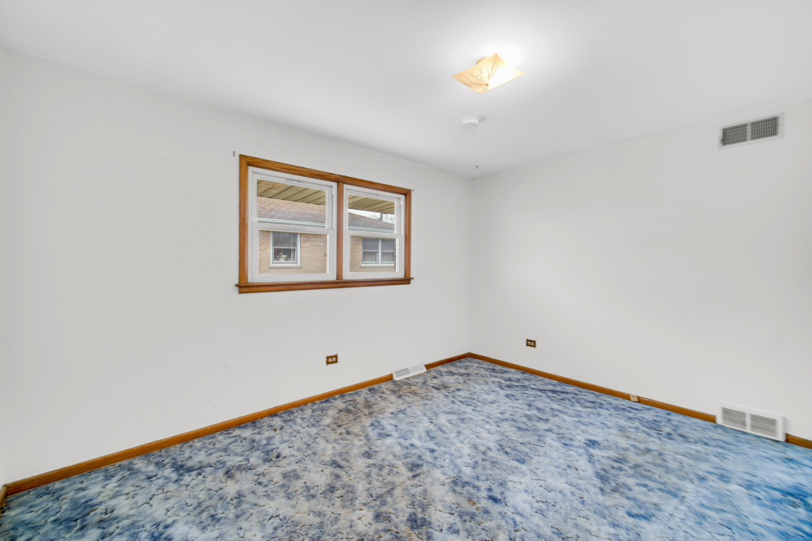 901 Oakton Street Park Ridge, IL 60068 - Photo 5 of 22 a view of an empty room with a window