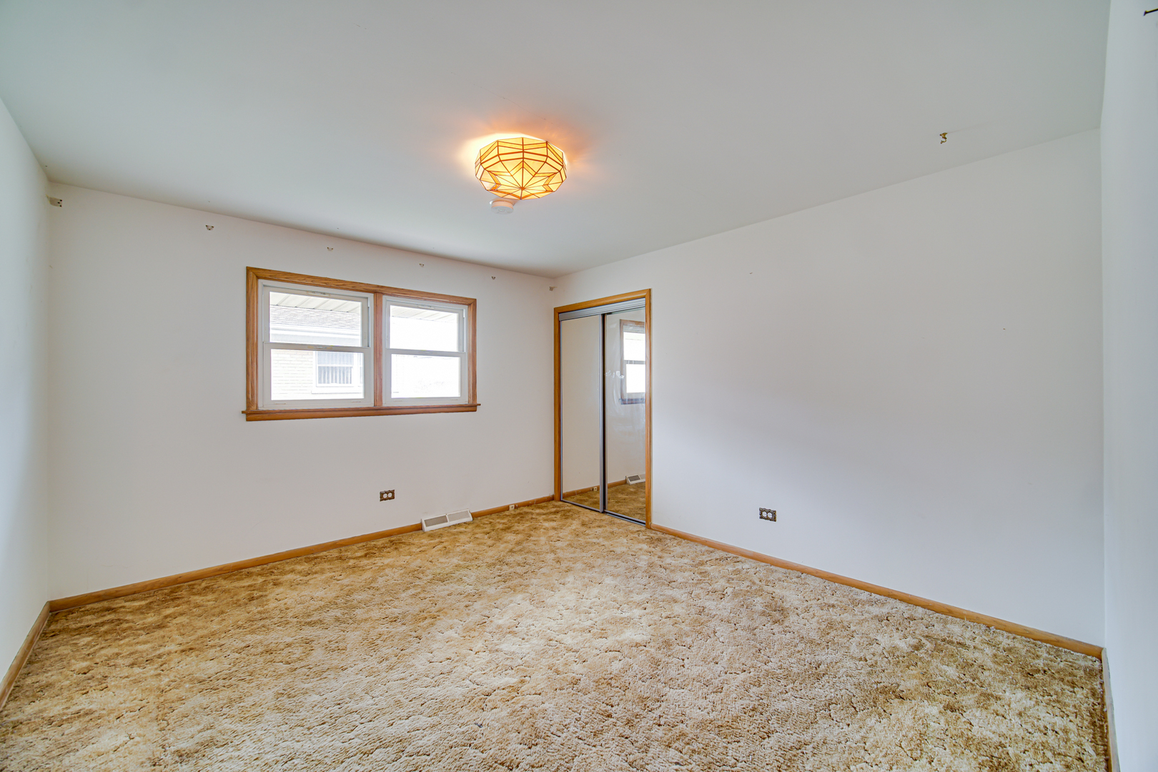901 Oakton Street Park Ridge, IL 60068 - Photo 8 of 22 a view of an empty room with a window