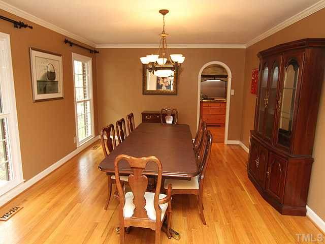 8644 Valley Brook Drive Raleigh, NC 27613 - Photo 5 of 18 DINING ROOM: Spacious room with gleaming hardwood floors and arched doorway to the kitchen with a pocket door!