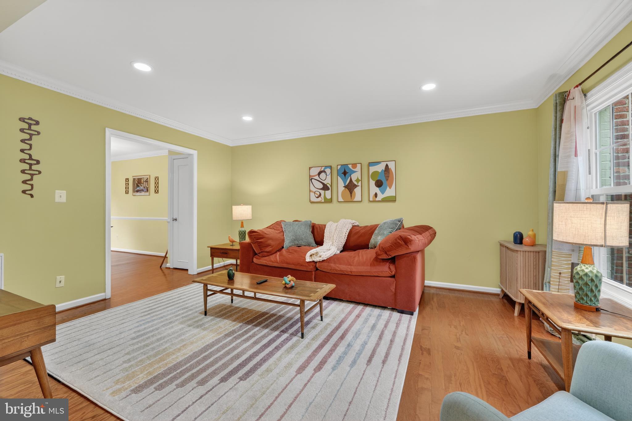 8139 Carrleigh Parkway Springfield, VA 22152 - Photo 3 of 27 a living room with furniture and wooden floor