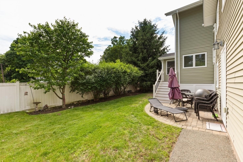 155 Adams Avenue Newton, MA 02465 - Photo 36 of 37 a view of backyard of house with seating space