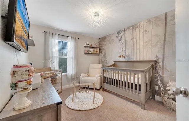 a bedroom with furniture and a window