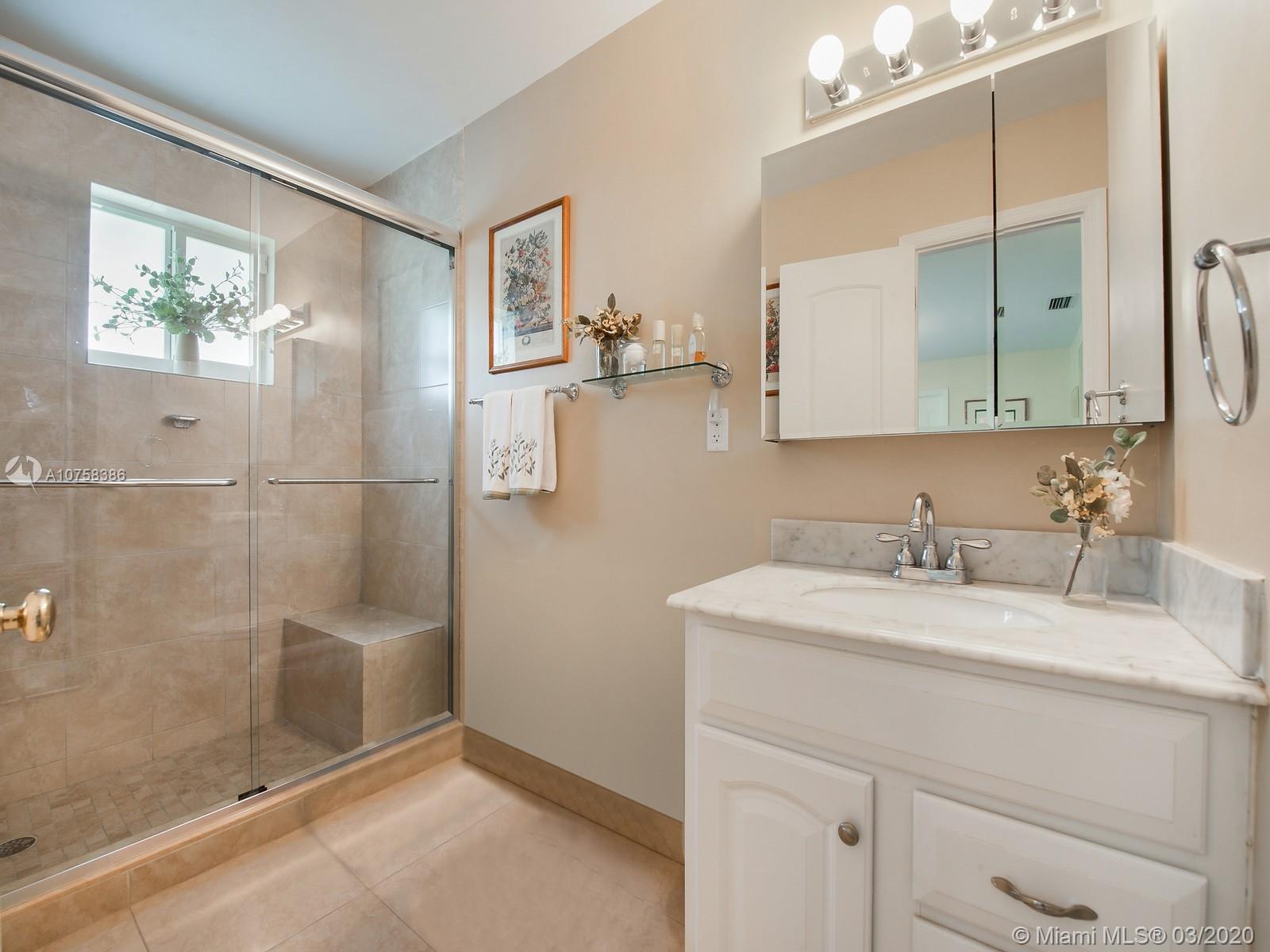 6701 Southwest 49th Terrace Miami, FL 33155 - Photo 13 of 24 a bathroom with a sink and a mirror
