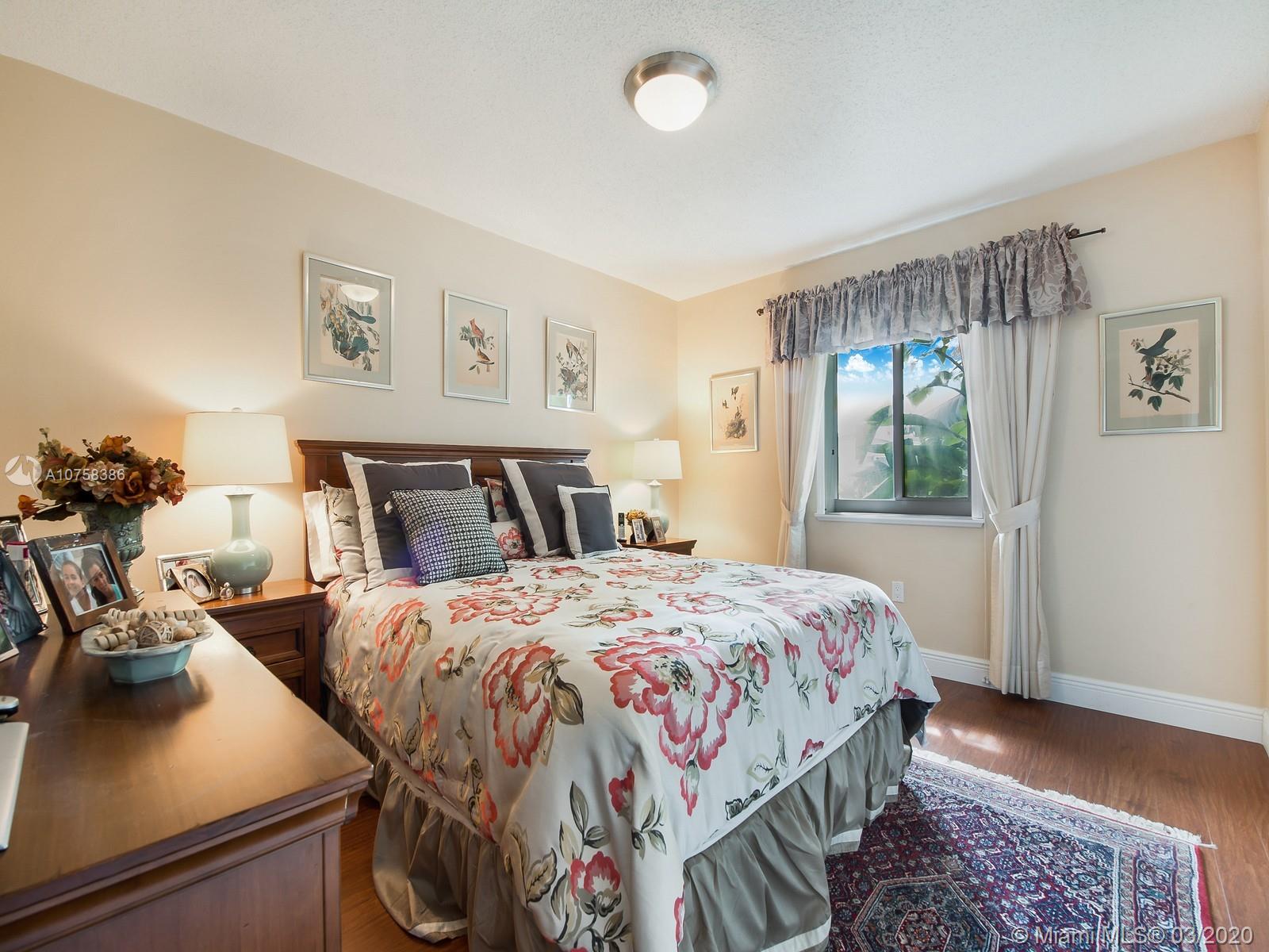 6701 Southwest 49th Terrace Miami, FL 33155 - Photo 14 of 24 a bedroom with bed and window