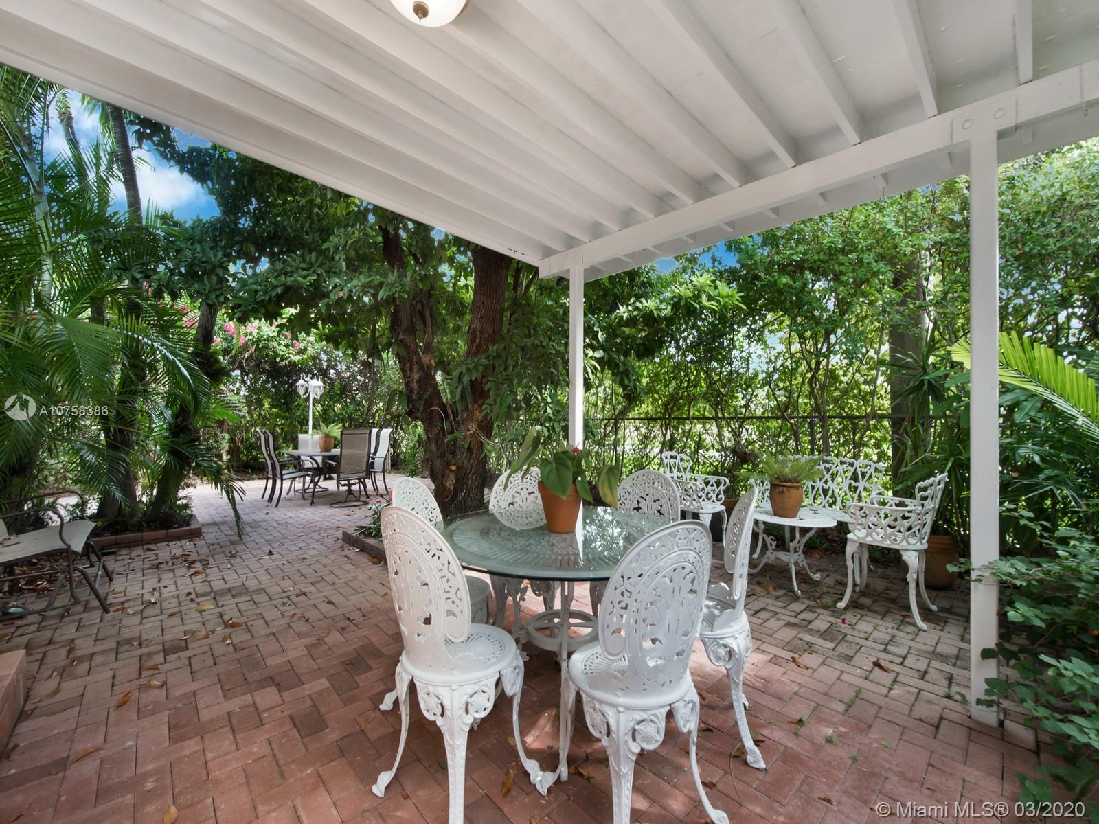 6701 Southwest 49th Terrace Miami, FL 33155 - Photo 19 of 24 a view of a chairs and table in patio