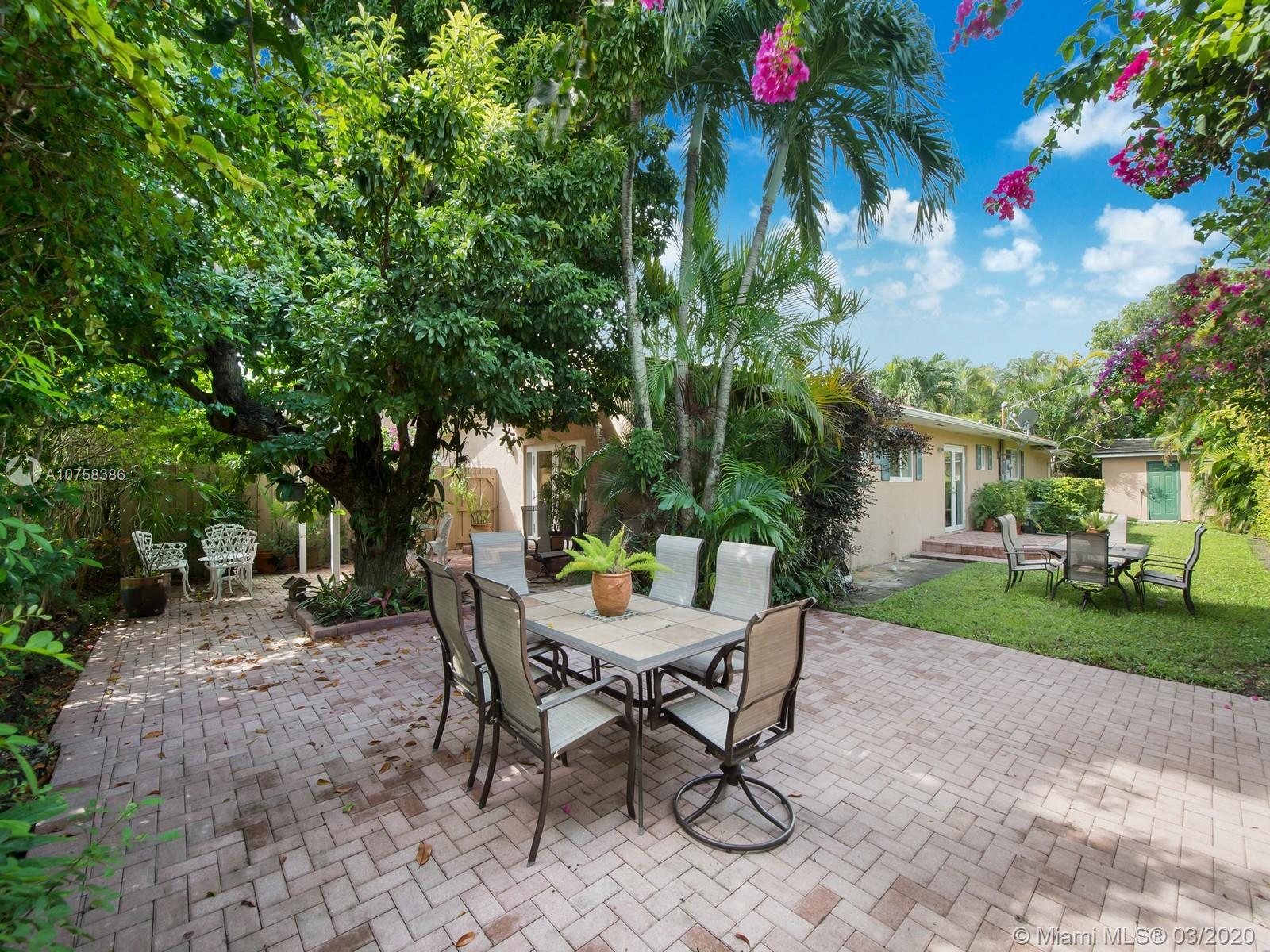 6701 Southwest 49th Terrace Miami, FL 33155 - Photo 20 of 24 a view of a backyard with a sitting area