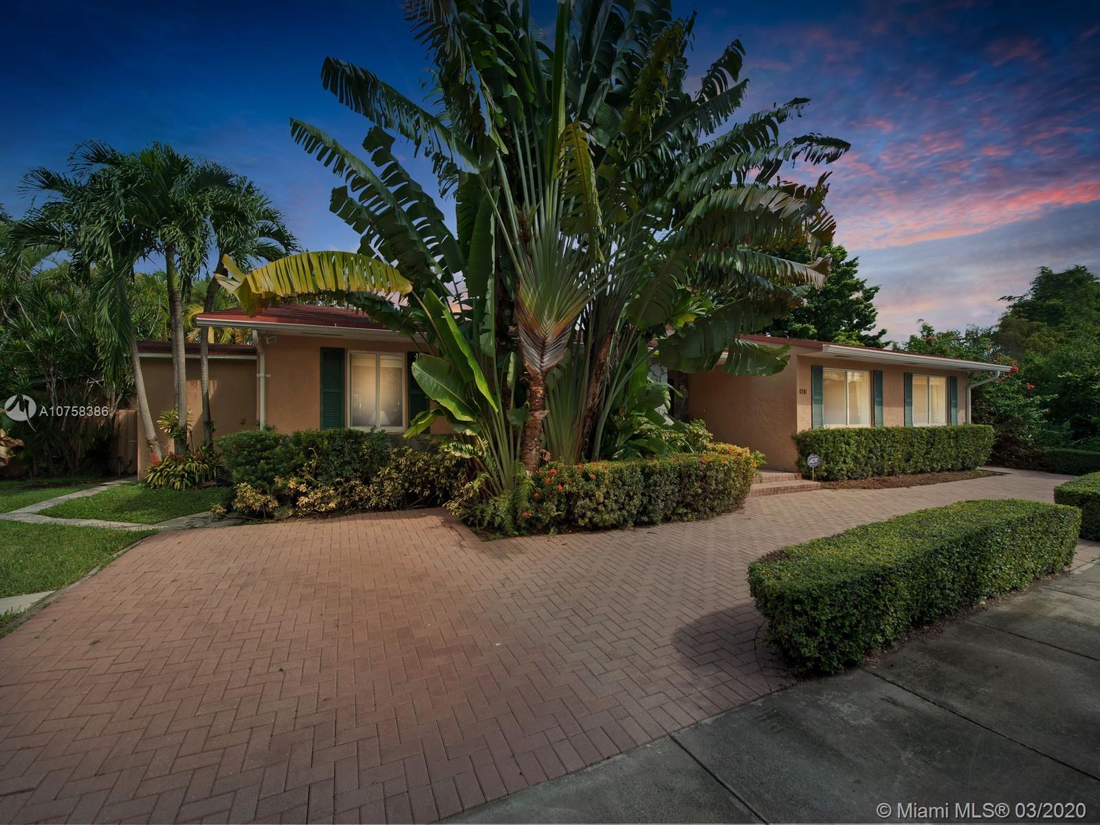 6701 Southwest 49th Terrace Miami, FL 33155 - Photo 21 of 24 a front view of a house with garden