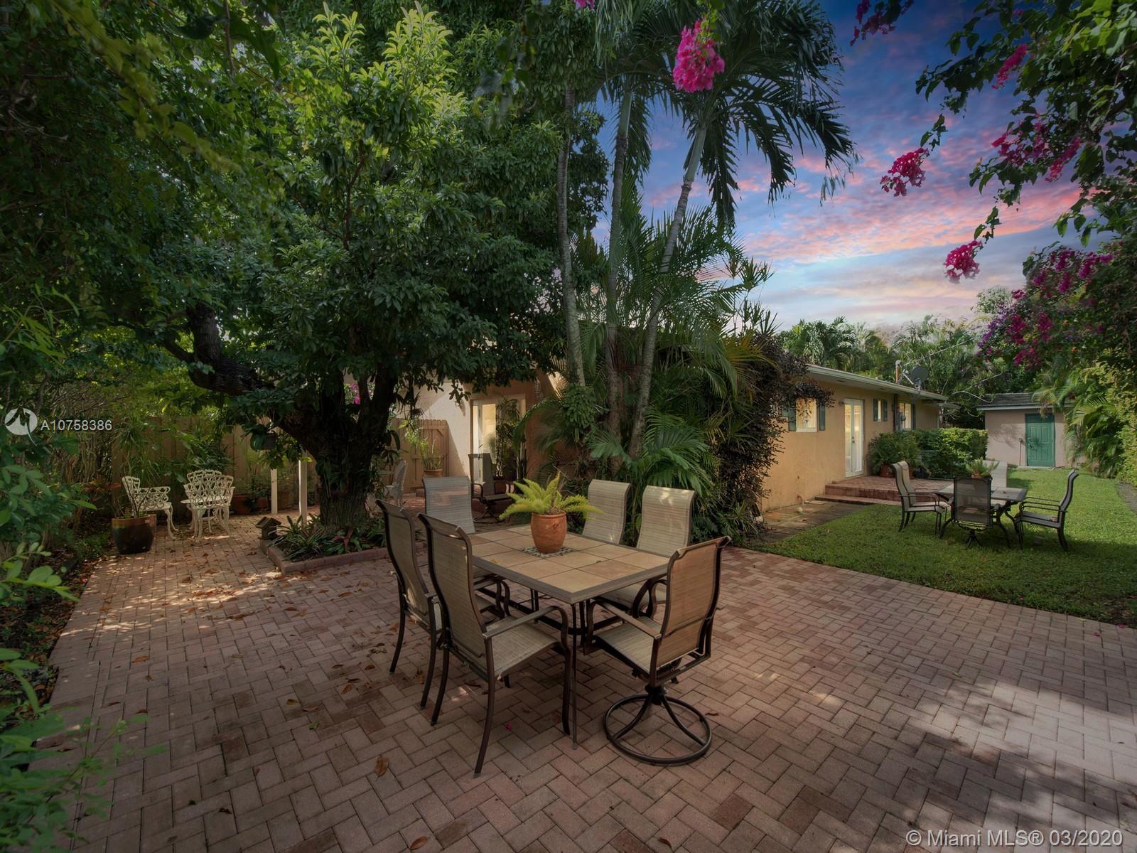 6701 Southwest 49th Terrace Miami, FL 33155 - Photo 22 of 24 a view of a backyard with a sitting area and furniture