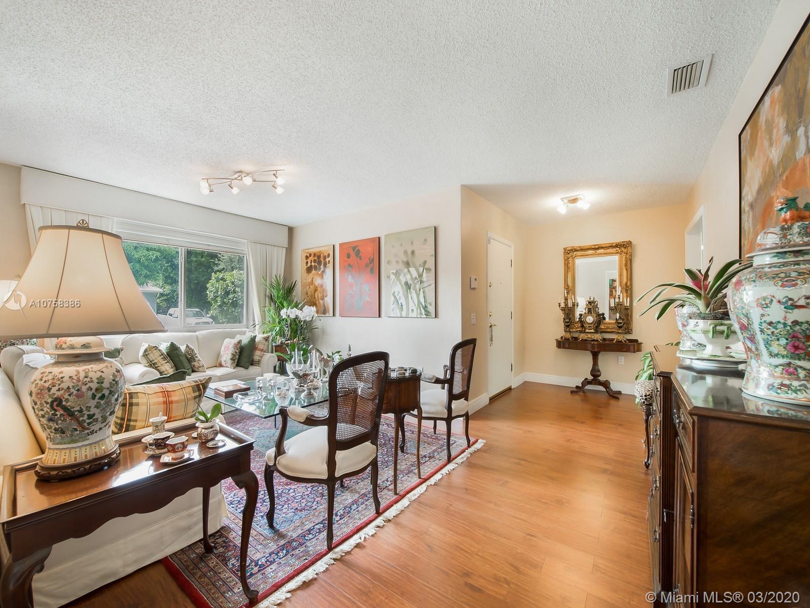 6701 Southwest 49th Terrace Miami, FL 33155 - Photo 4 of 24 a living room with furniture and a window