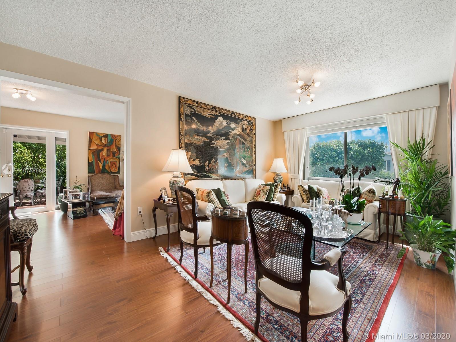 6701 Southwest 49th Terrace Miami, FL 33155 - Photo 5 of 24 a view of a livingroom with furniture window and wooden floor