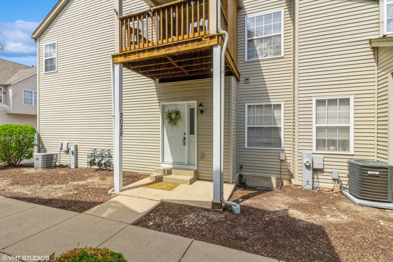2029 Frantum Road, Unit 2029 Sycamore, IL 60178 - Photo 1 of 18 a front view of a house with a yard