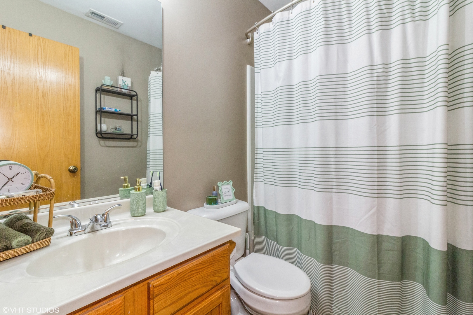 2029 Frantum Road, Unit 2029 Sycamore, IL 60178 - Photo 12 of 18 a bathroom with a sink a toilet and mirror