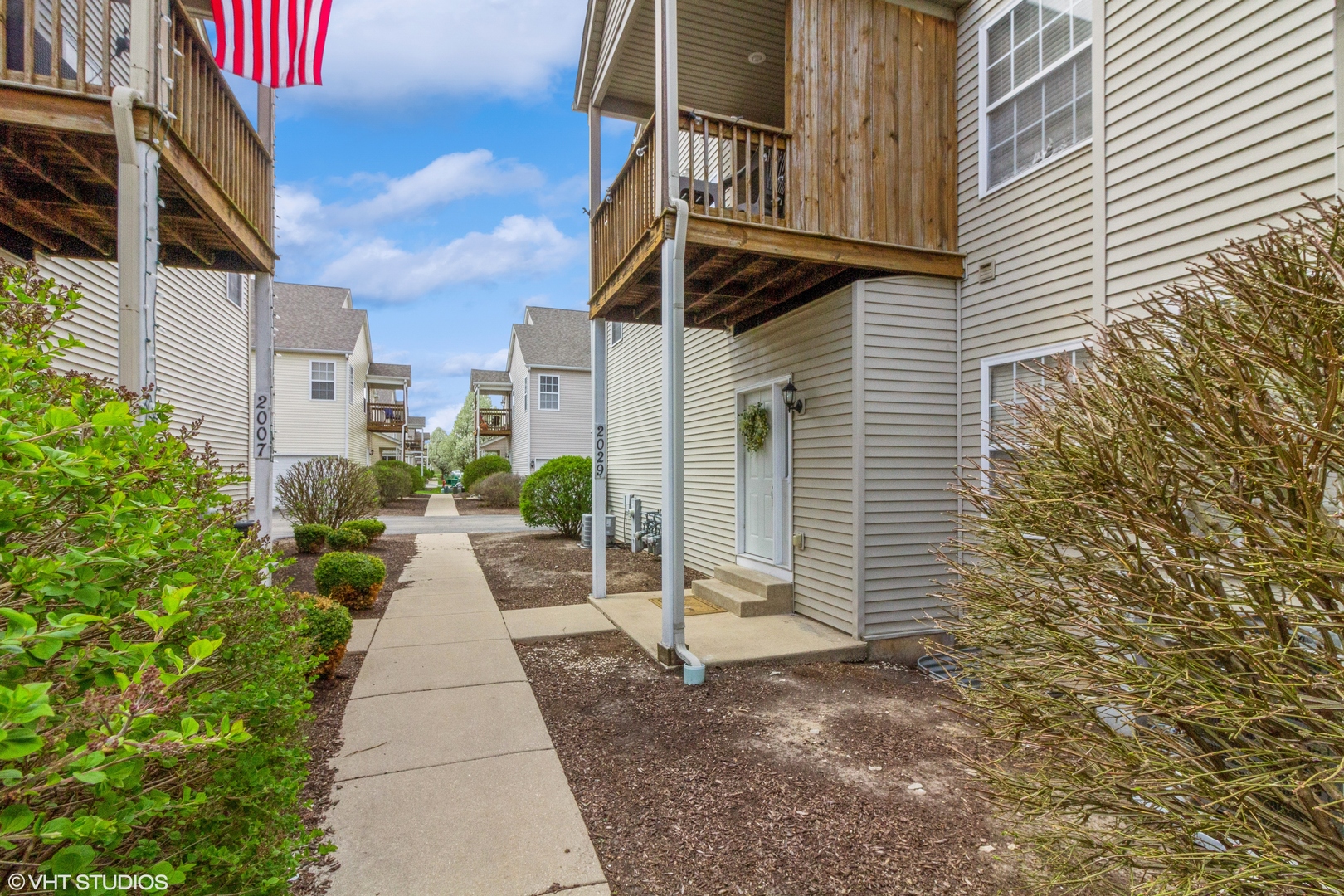2029 Frantum Road, Unit 2029 Sycamore, IL 60178 - Photo 16 of 18 a view of a pathway both side of building