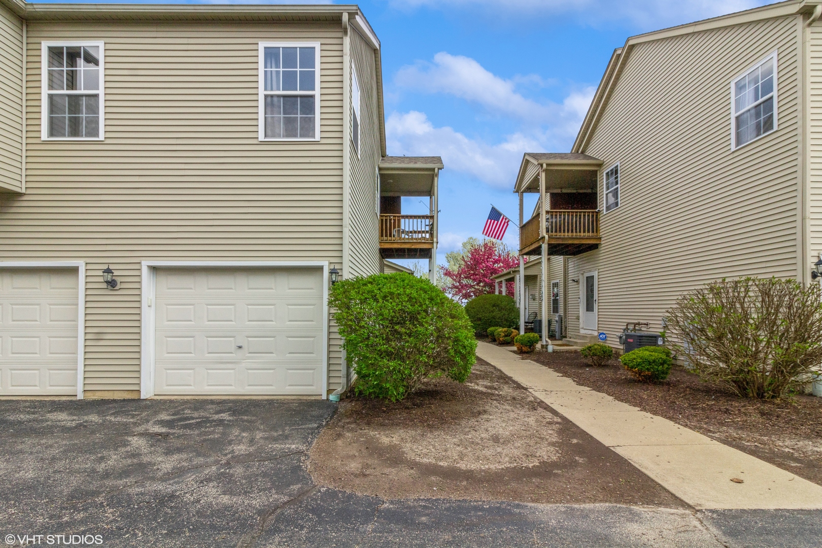 2029 Frantum Road, Unit 2029 Sycamore, IL 60178 - Photo 17 of 18 a front view of a house with a yard and garage