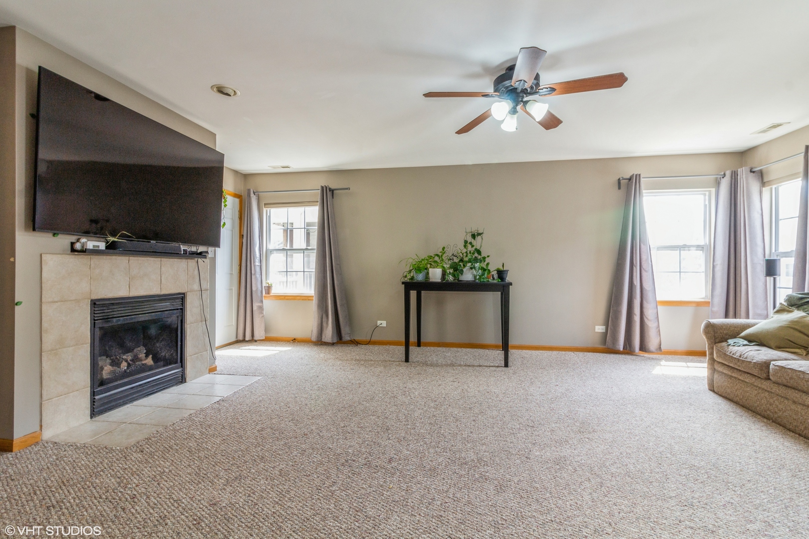 2029 Frantum Road, Unit 2029 Sycamore, IL 60178 - Photo 2 of 18 a living room with furniture and a fireplace